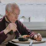 man eating to combat malnutrition in the elderly